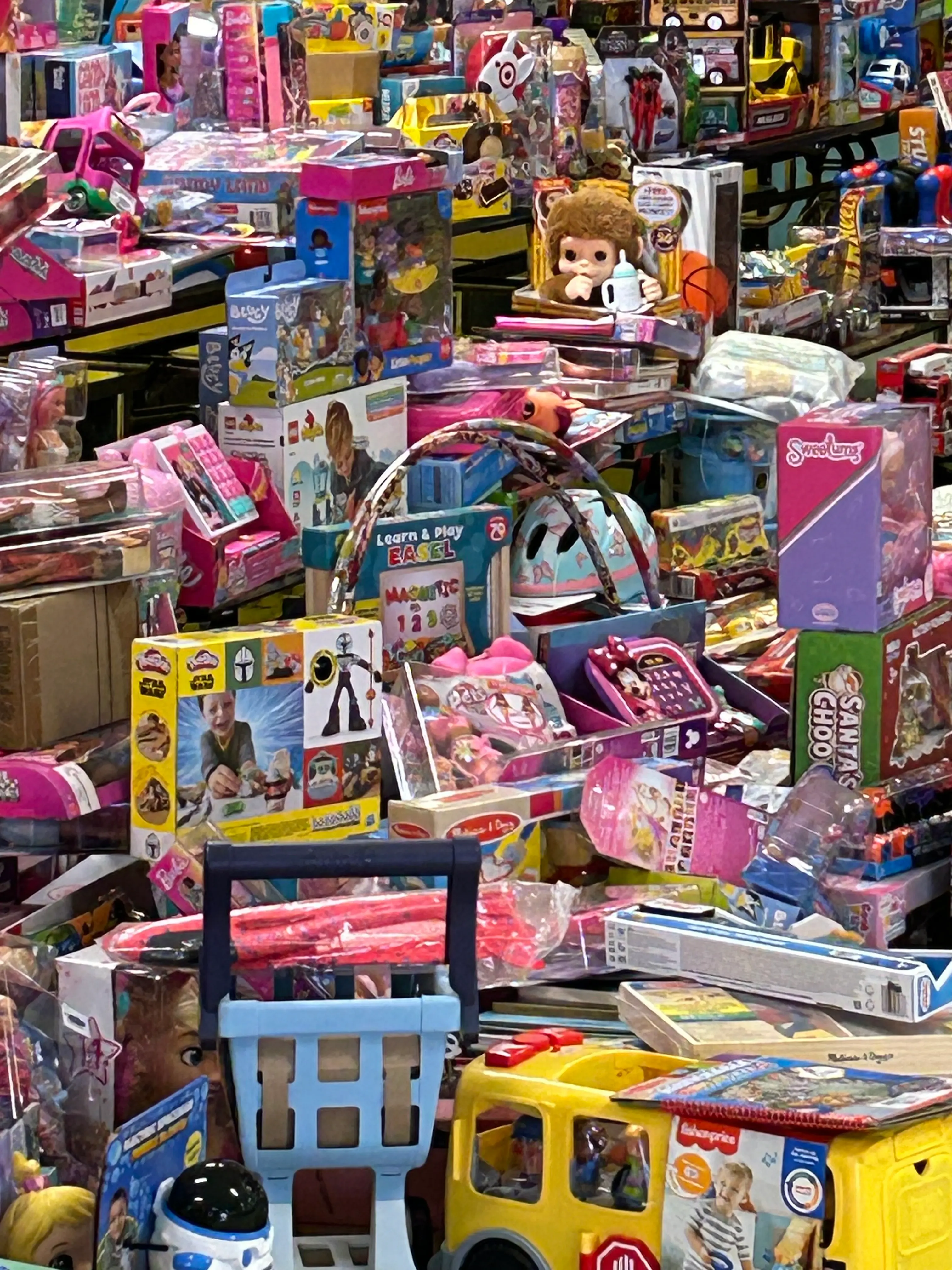 Tables piled high with donated Christmas toys still in their boxes